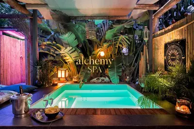 a hot tub in a room with plants at Naturarte Guesthouse in Terrasini