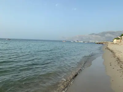a view of a beach with boats in the water at Casa vacanze Villa Grace in Villagrazia
