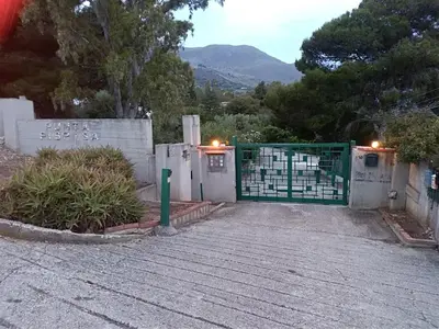 a gate to a house with a fence at Villa Marilù in Castellammare del Golfo