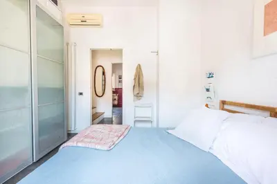 a bedroom with a blue bed in a room at Terrazza dei Colori alla Kalsa by Wonderful Italy in Palermo