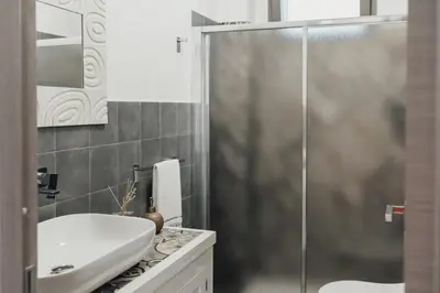 a bathroom with a shower and a sink at Giardini del Golfo Villa al Mare in Balestrate