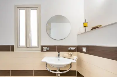 a bathroom with a sink and a mirror at Casa marty in Mondello