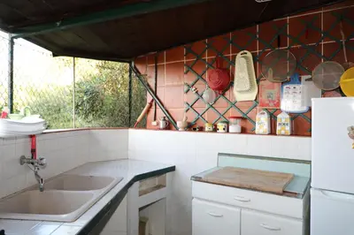 a kitchen with a sink and a counter top at Casa Elvira in Terrasini