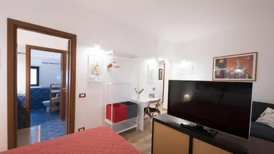 a living room with a large flat screen tv at Casa Annuccia ai Quattro Canti di Città in Palermo