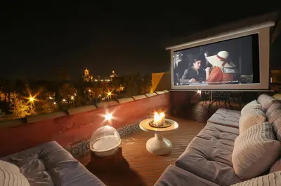 a large screen tv sitting on top of a balcony at Palermo Magic House in Palermo