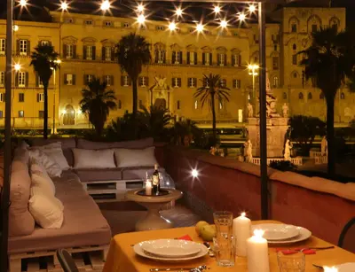 a view of a building from a patio at night at Palermo Magic House in Palermo