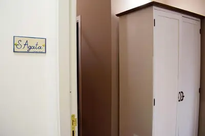a closet with a white cabinet in a room at B&B Benincasa in Palermo