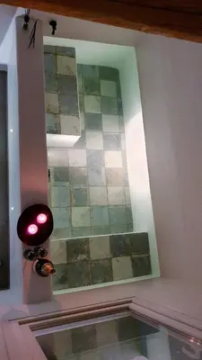a room with a window and a tile wall at Mediterraneo House in Palermo