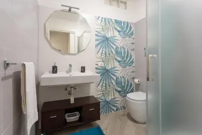 a bathroom with a sink and a mirror at villa Roby in Trappeto