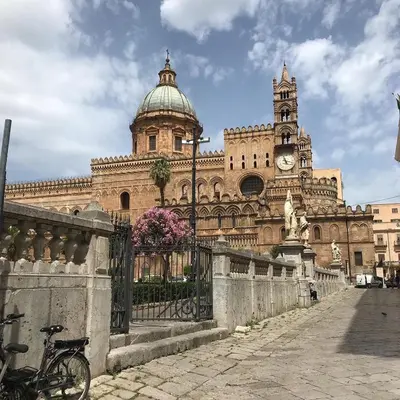 a large building with a clock tower on top of it at Affitto breve Casa Taormina in Palermo