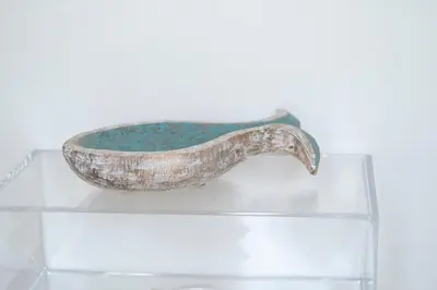 a bowl sitting on top of a glass table at Villa Acquamarina sul mare in San Vito lo Capo