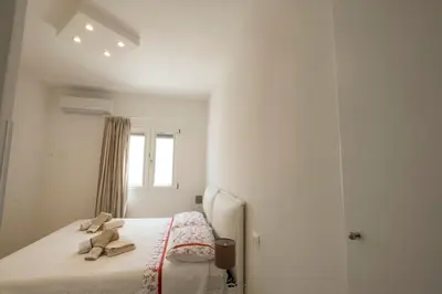 a bedroom with a bed with two towels on it at Villa Acquamarina sul mare in San Vito lo Capo