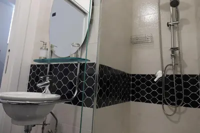 a bathroom with a sink and a shower at b&b Pirriera in Bagheria