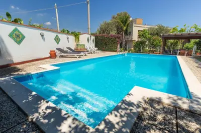 a swimming pool in the backyard of a house at Domus Sicily - Villa Conca d'Oro with Pool in Palermo