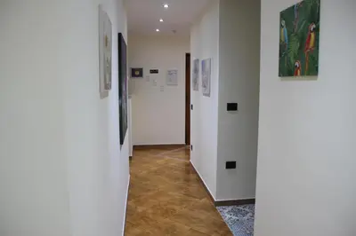 a hallway with white walls and tile floors at B&B Alexander-Room and Breakfast in Palermo