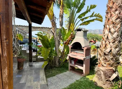 a outdoor oven in the yard of a house at Case Vacanza Zeus in Trappeto