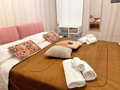 a bed with towels and towels on top of it at Residenza del Castillo in Palermo