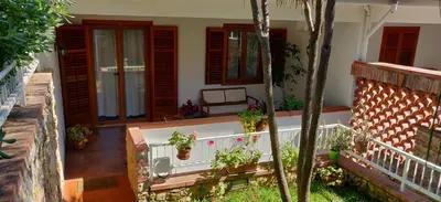 a balcony of a house with potted plants on it at Villetta a due passi dal mare in Palermo