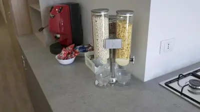 a kitchen counter with two containers of food at THE VIEW in Palermo