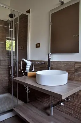 a bathroom with a white sink and a shower at Casa Rosetta in Palermo