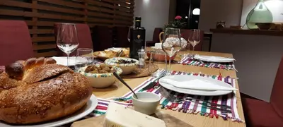 a table topped with a table with bread and wine glasses at Chiosi Country Club in Corleone