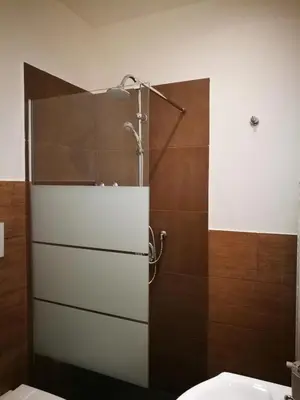 a bathroom with a shower with a toilet and a sink at BELLA PALERMO in Palermo