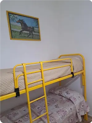 a bunk bed with a picture of a horse on the wall at Casa Mimì in Castellammare del Golfo