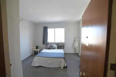 a bedroom with a bed and a window at STANZINA DELLA BARONESSA in Carini