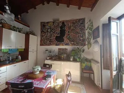 a room with paintings on the wall and plants at Anna's Home in Historical Center in Palermo