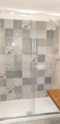 a shower with a glass door in a bathroom at Casa Margò in Monreale