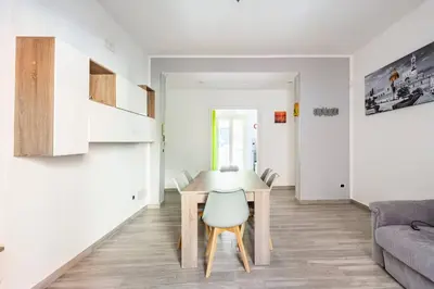 a small living room with a table and a couch at E.R. Apartment in Palermo