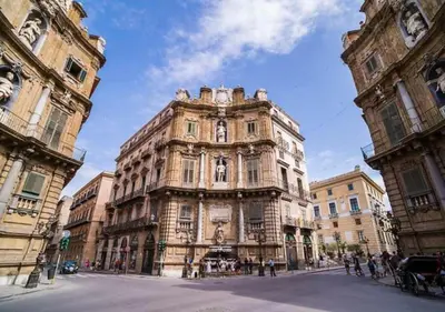 a large building in the middle of a street at E.R. Apartment in Palermo