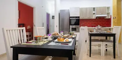 a kitchen with a table with food on it at LE STANZE DI LUCA in Palermo