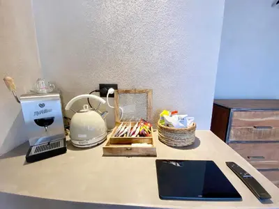 a counter top with a coffee maker and a blender at Casa Nostra Boutique Hotel & Spa in Palermo