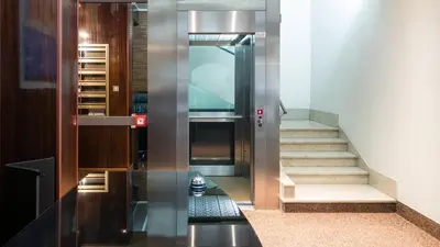an elevator in a building with a stair case at Cheap in Center in Palermo