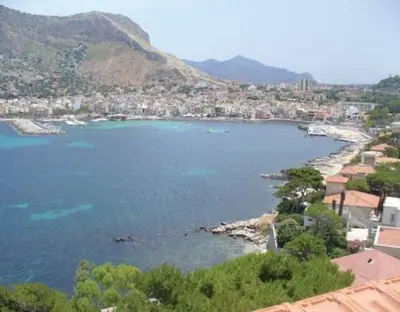 a view of a large body of water with a city at Bellevue del Golfo Hotel & Spa in Sferracavallo