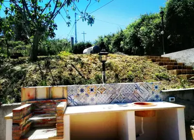 a bench sitting in front of some stairs at L'Opuntia sul lago in Caccamo
