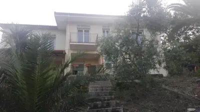 a white building with a staircase in front of it at L'Opuntia sul lago in Caccamo