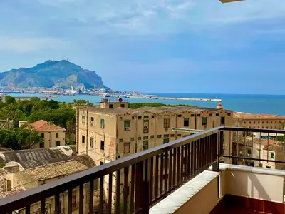 a balcony with a view of the ocean and buildings at CasaMare Sant'Erasmo Sea View apartment & suites in Palermo