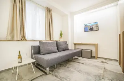 a living room with a couch and a fireplace at Oasi del Golfo Suites B&B in Castellammare del Golfo