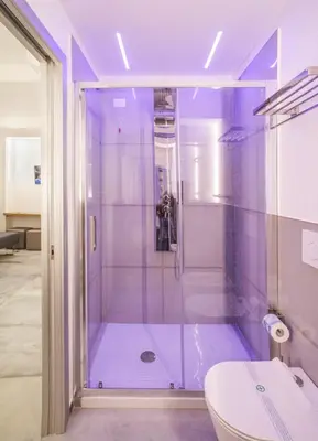 a bathroom with a shower and a toilet at Oasi del Golfo Suites B&B in Castellammare del Golfo