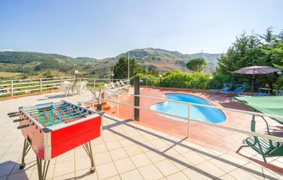 a board game on a deck next to a swimming pool at 5 Bedroom Nice Home In Monreale in Monreale