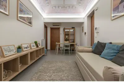 a living room with a couch and a table at H Urban in Palermo