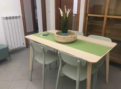 a table with chairs and a plant on top of it at H Urban in Palermo