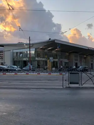 a store front with cars parked in a parking lot at Residenze Chamur Via Giuseppe Sciuti in Palermo
