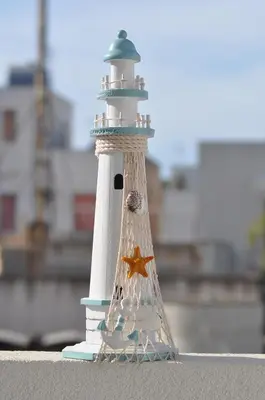 a miniature lighthouse with a star on it at La casa di fronte la spiaggia di San Vito lo capo in San Vito lo Capo