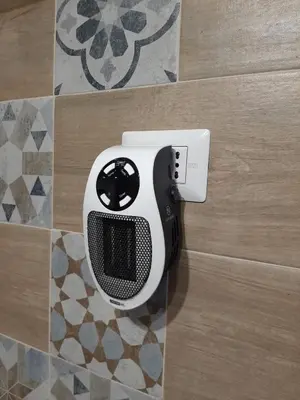 a black and white speaker on the wall of a bathroom at Il Sole della Guilla in Palermo