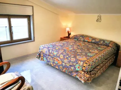 a bedroom with a bed with a colorful bedspread at Charming Villa in Monreale with Private Pool in Pioppo