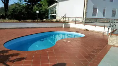 a swimming pool on a brick patio with a tile floor and a brickkeredkered at Charming Villa in Monreale with Private Pool in Pioppo