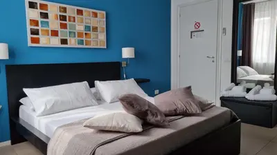 a bedroom with a bed with towels on it at Location10 in Palermo